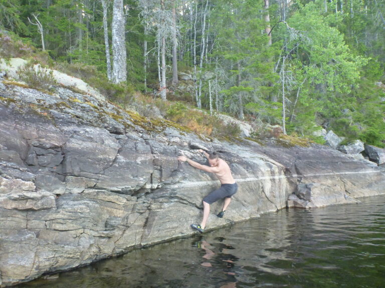 Bouldering a traverse just above the water level